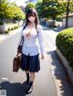 A woman in a school uniform is walking down the street.