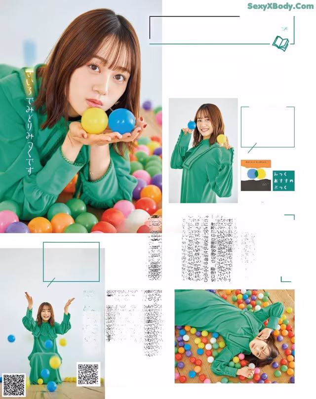 A woman in a green shirt is playing with colorful balls.