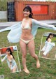 A woman in a white bikini posing for a picture.