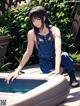 A woman sitting on top of a hot tub in a garden.