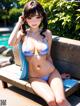 A woman in a blue bikini sitting on a bench by a pool.